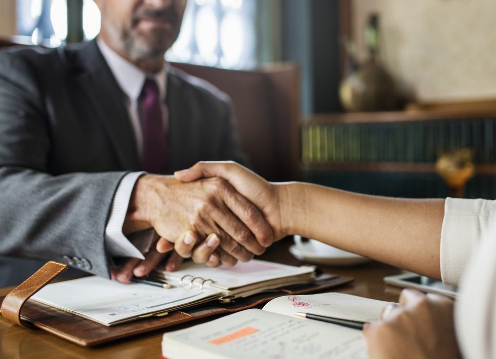 A Palmisano & Goodman attorney meeting with a client