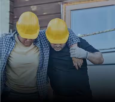 An injured construction worker assisted at a job site